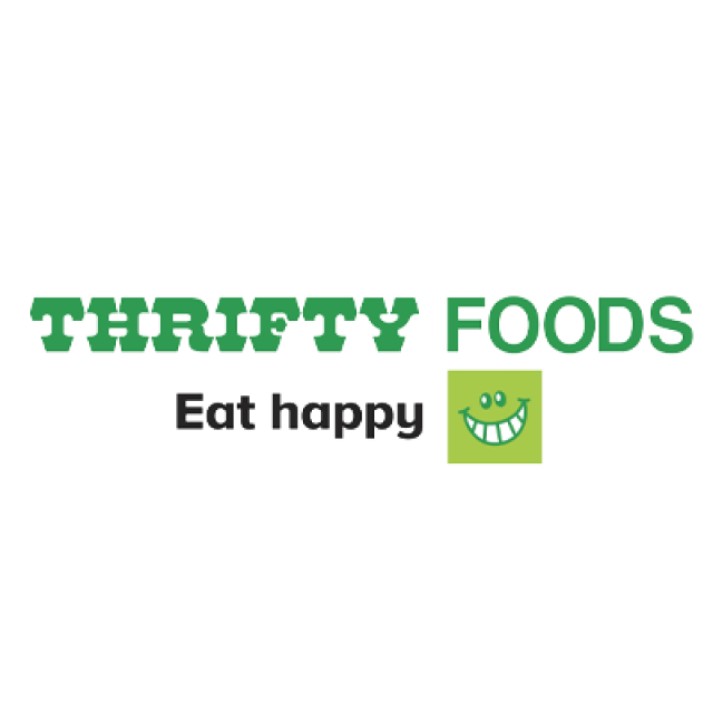 Thrifty Foods logo green with eat happy text and green smiling face